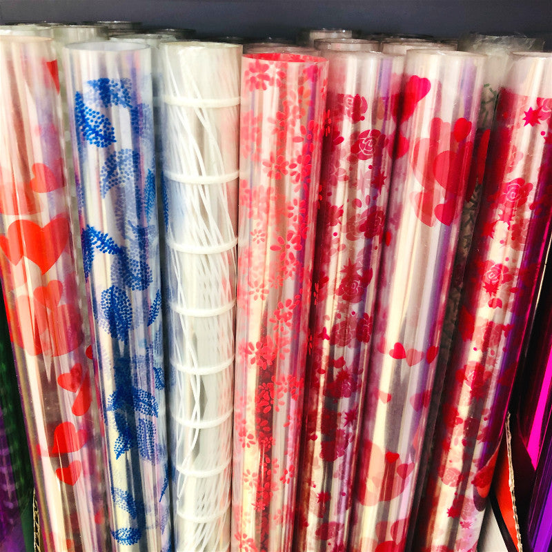 10 Rotoli di Cellophane Trasparente con Fantasie Colorate – 70cm x 2m ciascuno – Pellicola Decorativa per Regali, Fiori, Feste e Artigianato
