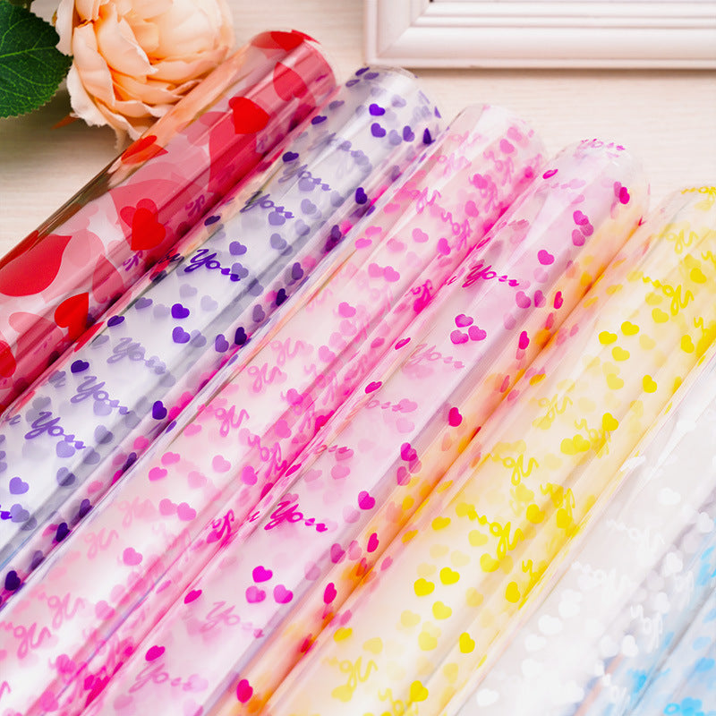 10 Rotoli di Cellophane Trasparente con Fantasie Colorate – 70cm x 2m ciascuno – Pellicola Decorativa per Regali, Fiori, Feste e Artigianato