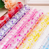 10 Rotoli di Cellophane Trasparente con Fantasie Colorate – 70cm x 2m ciascuno – Pellicola Decorativa per Regali, Fiori, Feste e Artigianato